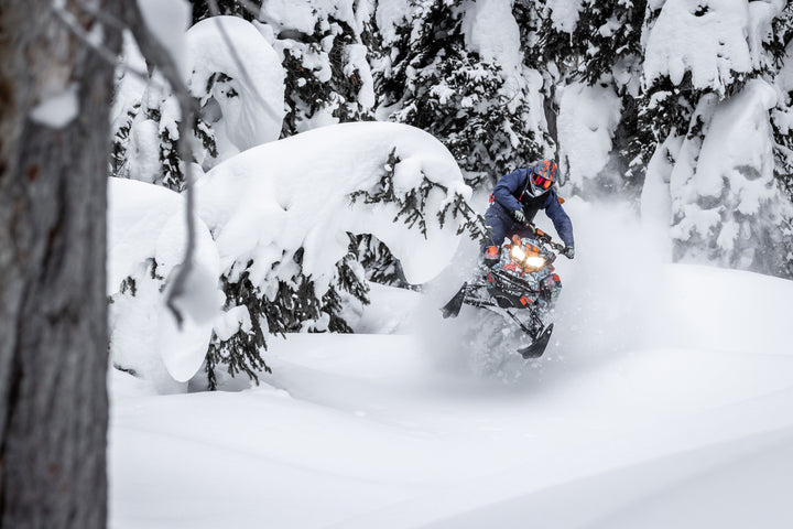 CFR racing snowmobiles in the deep snow